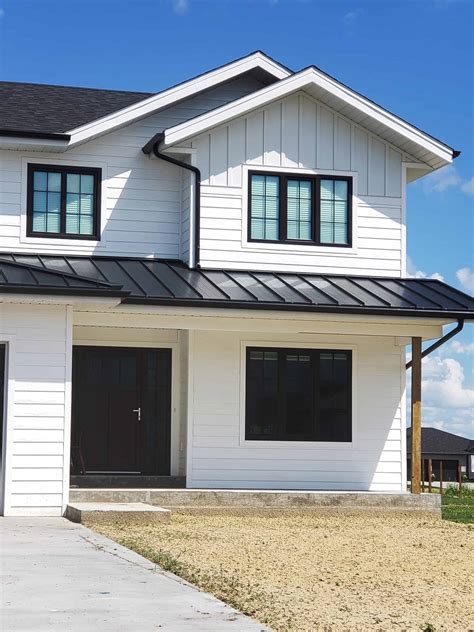 black metal windows front of house|black windows for homes.